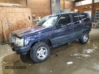 1997 Jeep Grand Cherokee Laredo with VIN 1J4GZ58Y7VC678708, listed as a Copart auction lot 87803725 with 312,585 mi miles and Salvage Title. Bid and sale history available at carsss.com. Image 1.
