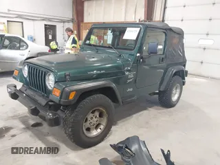 2000 Jeep Wrangler Sport with VIN 1J4FA49S2YP712526, listed as a IAAI auction lot 42151725 with 99,416 mi miles. Bid and sale history available at carsss.com. Image 2.