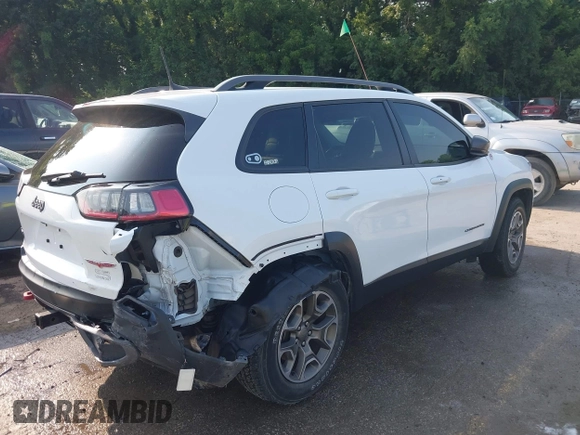 2021 Jeep Cherokee Trailhawk with VIN 1C4PJMBX4MD124980, listed as a IAAI auction lot 42372537 with 55,667 mi miles and . Bid and sale history available at DreamBid. Image 4.