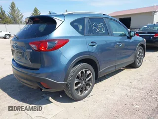 2016 Mazda CX-5 Grand Touring z VIN JM3KE4DY6G0785255, wystawiony jako IAAI lot #41887066 z przebiegiem 171 334 mil mil oraz . Historia ofert i sprzedaży dostępna na DreamBid. Obrazek 4.