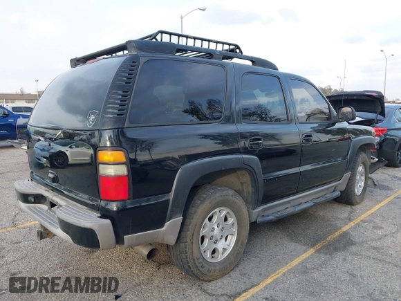 2004 Chevrolet Tahoe LS with VIN 1GNEK13T64R265302, listed as a IAAI auction lot 41445237 with 242,840 mi miles. Bid and sale history available at carsss.com. Image 4.