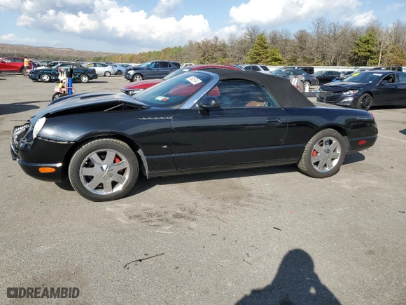 2003 Ford Thunderbird Deluxe with VIN 1FAHP60A63Y104093, listed as a Copart auction lot 76028744 with 79,995 mi miles and Salvage Title. Bid and sale history available at carsss.com. Image 1.