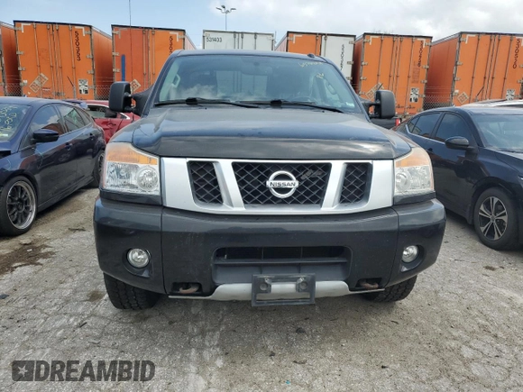 2015 Nissan Titan Pro-4X with VIN 1N6BA0EC1FN507894, listed as a Copart auction lot 65784274 with 147,576 mi miles and Salvage title. Bid and sale history available at DreamBid. Image 5.