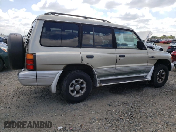 1998 Mitsubishi Montero z VIN JA4MR51RXWJ006418, wystawiony jako Copart lot #54878275 z przebiegiem 225 110 mil mil oraz Szkoda całkowita • Salvage title. Historia ofert i sprzedaży dostępna na DreamBid. Obrazek 3.