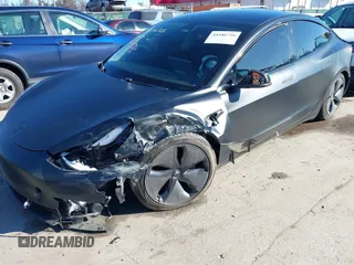 2020 Tesla Model 3 Standard Range Plus with VIN 5YJ3E1EA4LF745491, listed as a IAAI auction lot 41186726 with 74,575 mi miles and . Bid and sale history available at DreamBid. Image 20.