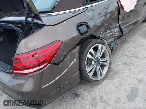 2014 Mercedes-Benz E-Class E 350 with VIN WDDKK5KF9EF242085, listed as a IAAI auction lot 41876938 with 75,760 mi miles. Bid and sale history available at carsss.com. Image 6.