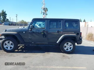 2018 Jeep Wrangler JK Unlimited Sport S with VIN 1C4BJWDG4JL868700, listed as a IAAI auction lot 41349566 with 68,539 mi miles. Bid and sale history available at carsss.com. Image 14.