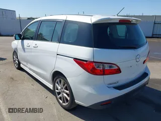 2012 Mazda 5 Touring with VIN JM1CW2CL7C0140452, listed as a IAAI auction lot 41970209 with 92,069 mi miles and . Bid and sale history available at DreamBid. Image 3.
