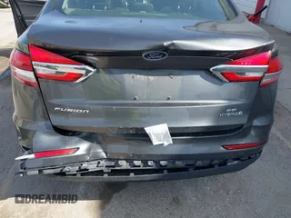 2019 Ford Fusion Hybrid SE with VIN 3FA6P0LU6KR163927, listed as a IAAI auction lot 41834612 with 104,342 mi miles. Bid and sale history available at carsss.com. Image 6.