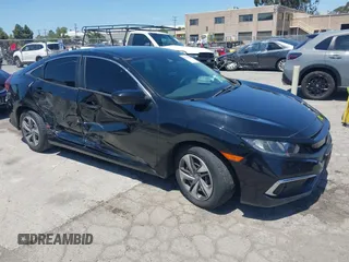 2020 Honda Civic LX with VIN 19XFC2F66LE213975, listed as a IAAI auction lot 42398098 with 69,902 mi miles and . Bid and sale history available at DreamBid. Image 1.