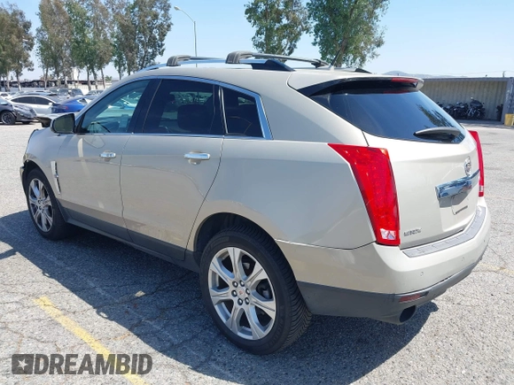 2011 Cadillac SRX Premium Collection z VIN 3GYFNCEY3BS506360, wystawiony jako IAAI lot #42096225 z przebiegiem 173 514 mil mil oraz . Historia ofert i sprzedaży dostępna na DreamBid. Obrazek 3.