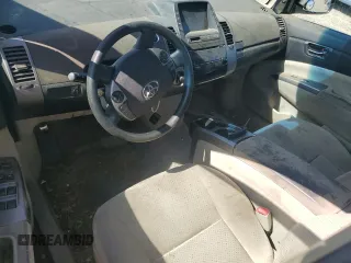 2006 Toyota Prius z VIN JTDKB20U167517552, wystawiony jako Copart lot #59218575 z przebiegiem Nie podano mil oraz Szkoda całkowita • Salvage title. Historia ofert i sprzedaży dostępna na DreamBid. Obrazek 8.