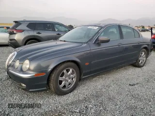 2000 Jaguar S-Type V8 with VIN SAJDA01D0YGL26384, listed as a Copart auction lot 83484974 with 156,318 mi miles and Clean Title. Bid and sale history available at DreamBid. Image 1.