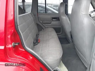 1996 Jeep Cherokee Sport with VIN 1J4FJ68S6TL299152, listed as a IAAI auction lot 41004736 with 277,819 mi miles. Bid and sale history available at carsss.com. Image 8.
