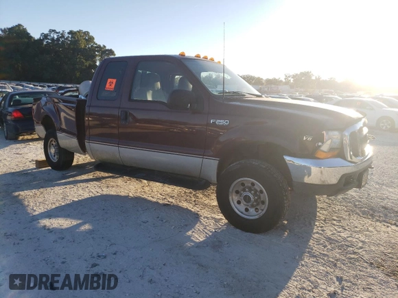 2000 Ford F-250 XL with VIN 1FTNX21L6YEE29549, listed as a Copart auction lot 74982324 with 133,883 mi miles and Salvage title. Bid and sale history available at DreamBid. Image 4.