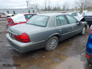 2003 Mercury Grand Marquis LS Premium with VIN 2MEFM75W33X655360, listed as a IAAI auction lot 41922734 with 86,059 mi miles. Bid and sale history available at carsss.com. Image 4.