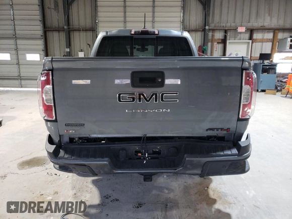 2022 GMC Canyon 4WD AT4 w/Leather with VIN 1GTG6FEN1N1175900, listed as a Copart auction lot 85957514 with 56,811 mi miles and Salvage Title. Bid and sale history available at carsss.com. Image 6.