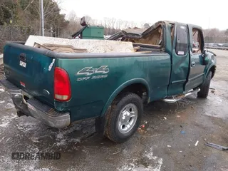 1999 Ford F-150 XL with VIN 1FTRX18L9XNA66552, listed as a IAAI auction lot 41284259 with Not provided miles and . Bid and sale history available at DreamBid. Image 4.