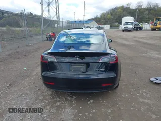 2021 Tesla Model 3 Long Range with VIN 5YJ3E1EB7MF052988, listed as a IAAI auction lot 42052662 with 29,877 mi miles and . Bid and sale history available at carsss.com. Image 16.