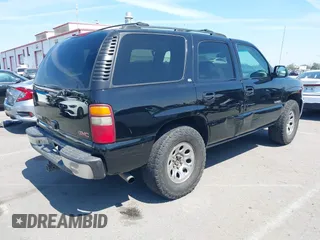 2002 GMC Yukon SLT with VIN 1GKEC13T92R162978, listed as a IAAI auction lot 41851599 with 213,789 mi miles. Bid and sale history available at carsss.com. Image 4.