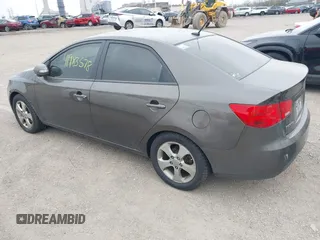 2010 Kia Forte EX with VIN KNAFU4A26A5287755, listed as a IAAI auction lot 41983578 with 273,765 mi miles. Bid and sale history available at carsss.com. Image 3.