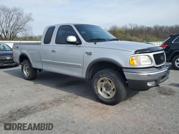 2003 Ford F-150 XL with VIN 1FTRX18L23NA66919, listed as a Copart auction lot 52911285 with 153,870 mi miles and Salvage Title. Bid and sale history available at carsss.com. Image 4.