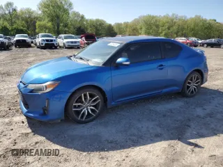 2016 Scion tC z VIN JTKJF5C75GJ022534, wystawiony jako Copart lot #52254005 z przebiegiem 103 812 mil mil oraz Szkody całkowita. Historia ofert i sprzedaży dostępna na DreamBid. Obrazek 1.