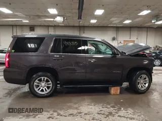 2015 Chevrolet Tahoe LT z VIN 1GNSKBKC1FR111299, wystawiony jako IAAI lot #41887115 z przebiegiem 157 666 mil mil oraz . Historia ofert i sprzedaży dostępna na DreamBid. Obrazek 14.