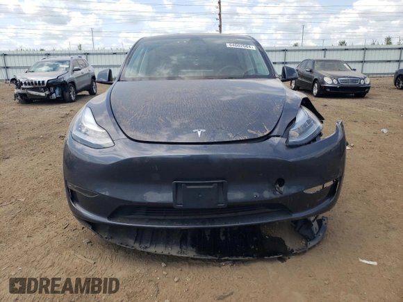 2022 Tesla Model Y Long Range with VIN 7SAYGDEE3NA007737, listed as a Copart auction lot 64602984 with 42,597 mi miles and Salvage Title. Bid and sale history available at carsss.com. Image 5.