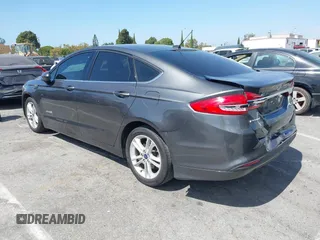 2018 Ford Fusion Hybrid SE with VIN 3FA6P0LU4JR261594, listed as a IAAI auction lot 40360797 with 128,533 mi miles. Bid and sale history available at carsss.com. Image 3.