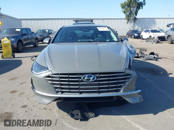 2022 Hyundai Sonata Hybrid Blue with VIN KMHL24JJ1NA041773, listed as a IAAI auction lot 41043553 with 23,696 mi miles. Bid and sale history available at carsss.com. Image 13.