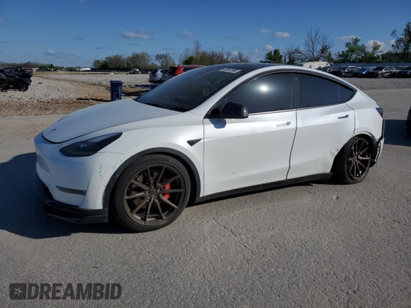 2021 Tesla Model Y Performance with VIN 5YJYGDEF3MF262878, listed as a Copart auction lot 52897595 with 50,939 mi miles and Salvage Title. Bid and sale history available at DreamBid. Image 1.