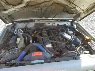 2000 Jeep Cherokee z VIN 1J4FF48S9YL220831, wystawiony jako Copart lot #54304615 z przebiegiem Nie podano mil oraz Szkoda całkowita • Salvage title. Historia ofert i sprzedaży dostępna na DreamBid. Obrazek 11.