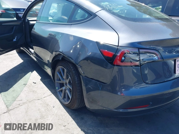 2022 Tesla Model 3 with VIN 5YJ3E1EA0NF344782, listed as a IAAI auction lot 41803469 with 16,973 mi miles and . Bid and sale history available at DreamBid. Image 6.