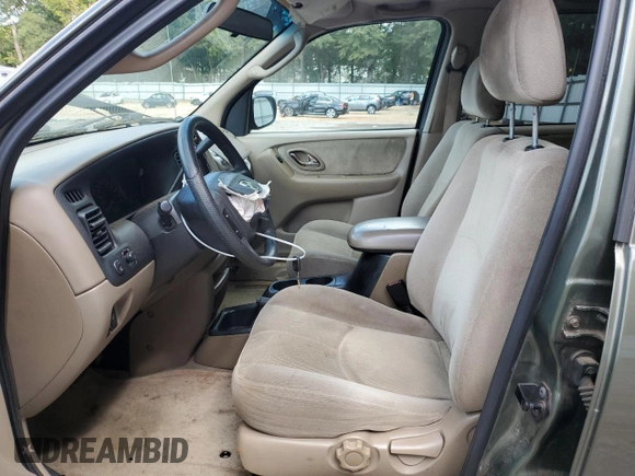 2002 Mazda Tribute LX with VIN 4F2YU09122KM55085, listed as a Copart auction lot 71604184 with 185,158 mi miles and Salvage Title. Bid and sale history available at DreamBid. Image 7.