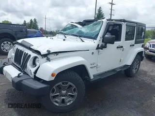 2016 Jeep Wrangler Unlimited Sahara with VIN 1C4BJWEG8GL129577, listed as a IAAI auction lot 42184373 with 185,761 mi miles and . Bid and sale history available at DreamBid. Image 2.