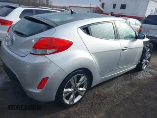 2017 Hyundai Veloster with VIN KMHTC6AD2HU324740, listed as a IAAI auction lot 41574415 with 66,685 mi miles. Bid and sale history available at carsss.com. Image 4.