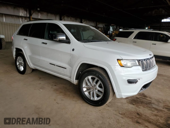 2017 Jeep Grand Cherokee Overland with VIN 1C4RJFCG2HC834328, listed as a Copart auction lot 45199855 with 87,061 mi miles and Salvage Title. Bid and sale history available at carsss.com. Image 4.