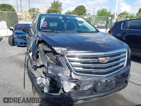 2018 Cadillac XT5 Luxury FWD with VIN 1GYKNCRS4JZ133643, listed as a IAAI auction lot 41916134 with 68,005 mi miles and . Bid and sale history available at carsss.com. Image 1.