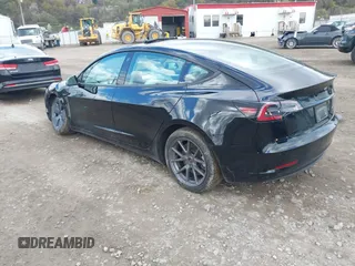 2021 Tesla Model 3 Long Range with VIN 5YJ3E1EB7MF052988, listed as a IAAI auction lot 42052662 with 29,877 mi miles and . Bid and sale history available at carsss.com. Image 3.