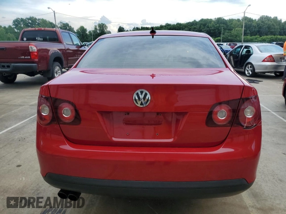2010 Volkswagen Jetta Wolfsburg Edition with VIN 3VWRJ7AJXAM154666, listed as a Copart auction lot 60556875 with 149,509 mi miles and Salvage title. Bid and sale history available at DreamBid. Image 6.