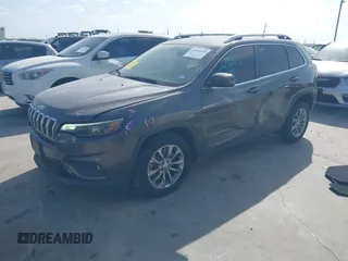 2019 Jeep Cherokee Latitude Plus with VIN 1C4PJLLB0KD382309, listed as a IAAI auction lot 41812968 with 144,368 mi miles. Bid and sale history available at carsss.com. Image 2.