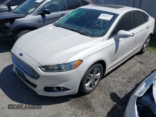2016 Ford Fusion Titanium Hybrid with VIN 3FA6P0RU1GR259947, listed as a IAAI auction lot 41695377 with 97,605 mi miles. Bid and sale history available at carsss.com. Image 2.