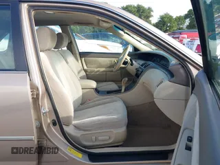 2001 Toyota Avalon XL z VIN 4T1BF28B31U185174, wystawiony jako IAAI lot #42338204 z przebiegiem 298 540 mil mil oraz . Historia ofert i sprzedaży dostępna na DreamBid. Obrazek 5.