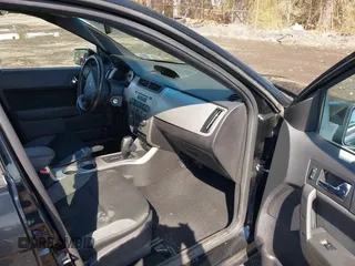 2009 Ford Focus SES with VIN 1FAHP36N49W207901, listed as a IAAI auction lot 41875523 with 95,089 mi miles. Bid and sale history available at carsss.com. Image 5.