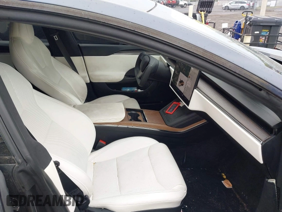 2021 Tesla Model S Long Range with VIN 5YJSA1E5XMF428519, listed as a IAAI auction lot 41926242 with 54,284 mi miles and . Bid and sale history available at DreamBid. Image 5.