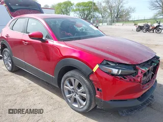 2021 Mazda CX-30 Select z VIN 3MVDMBBL8MM250466, wystawiony jako IAAI lot #42213224 z przebiegiem 27 886 mil mil oraz . Historia ofert i sprzedaży dostępna na DreamBid. Obrazek 1.
