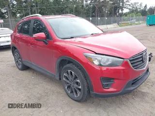2016 Mazda CX-5 Grand Touring z VIN JM3KE4DY7G0687318, wystawiony jako IAAI lot #42228585 z przebiegiem 188 793 mil mil oraz . Historia ofert i sprzedaży dostępna na DreamBid. Obrazek 1.