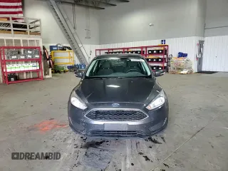 2018 Ford Focus SE z VIN 1FADP3FE4JL289830, wystawiony jako Copart lot #53350265 z przebiegiem 72 963 mil mil oraz Szkoda całkowita • Salvage title. Historia ofert i sprzedaży dostępna na DreamBid. Obrazek 13.
