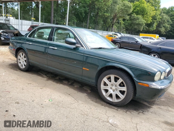 2004 Jaguar XJ with VIN SAJWA71C34SG16508, listed as a Copart auction lot 66751644 with 179,039 mi miles and Salvage Title. Bid and sale history available at carsss.com. Image 4.